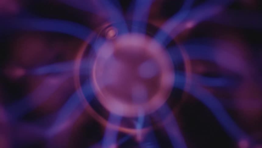 Beams of purple and blue energy emanating from a sphere