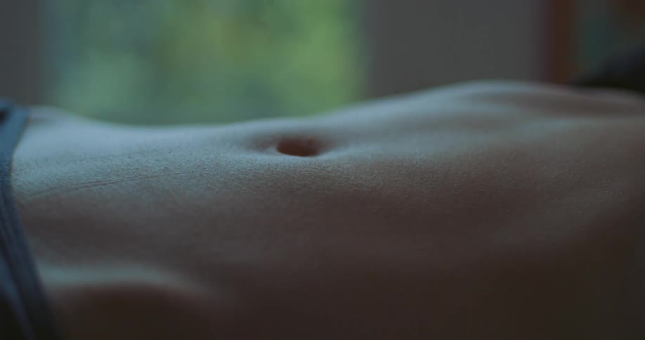 A persons stomach goes up and down as they breath