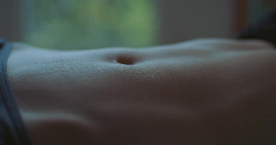 A womans belly is showing