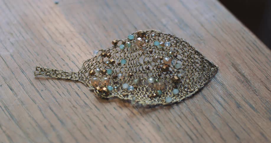Closeup of an earring with sparkling gemstones