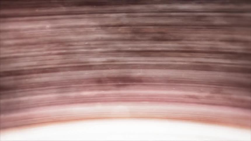 A glowing sphere spinning rays of light around a planet in space