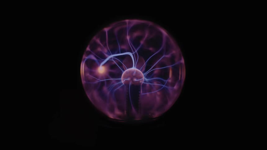 Blue bolts play about interior of plasma sphere against a black background