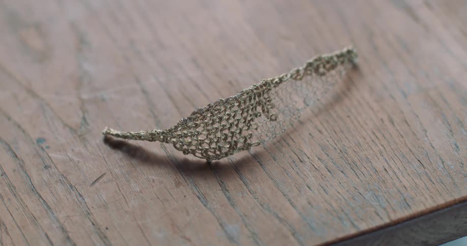 Leaf brooch lying on table