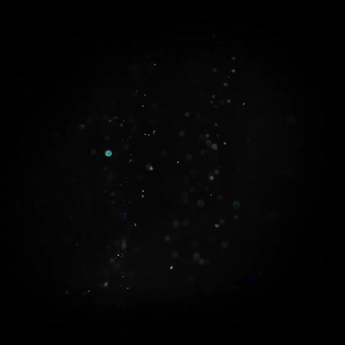 The debris floats around in the dark