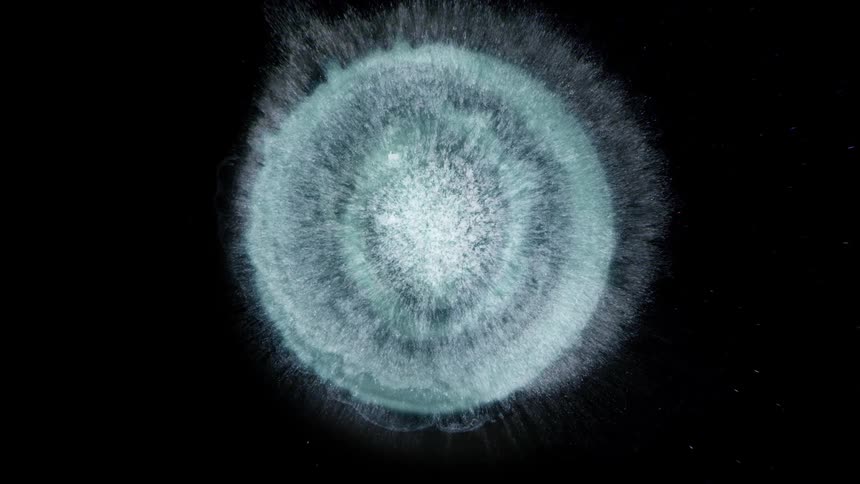 A huge star in space exploding into many pieces
