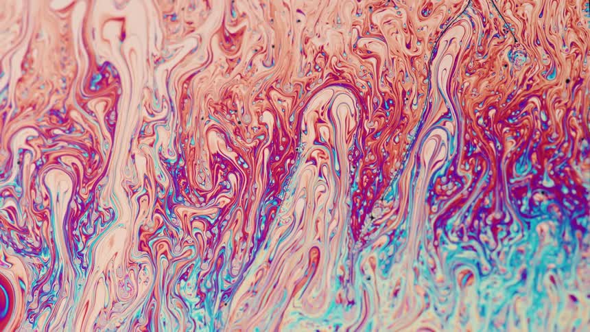 Abstract colorful oil paint swirling