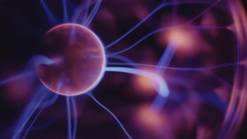 Some cell like structure like a ball with blue strings attached to it as it spins