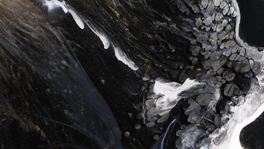 Black white and abstract liquid being spilled