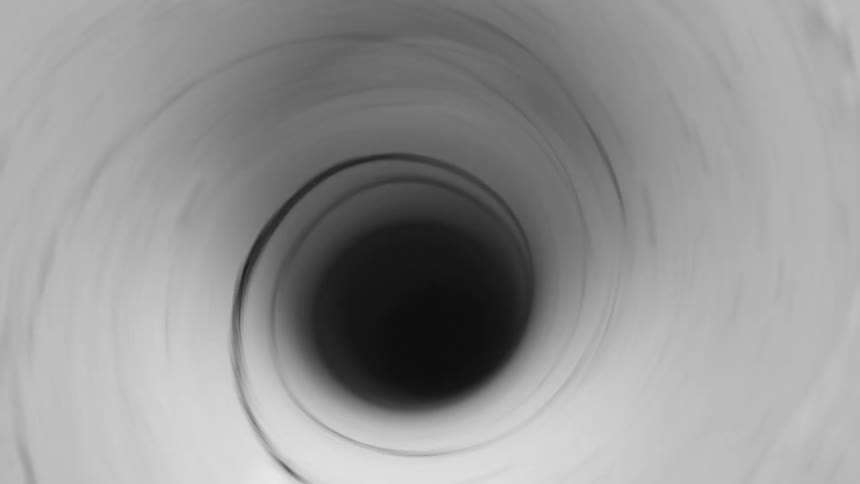 Black ink pours down swirling white ink