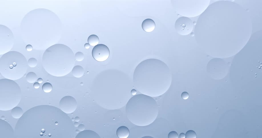 Circular bubbles floating in transparent liquid