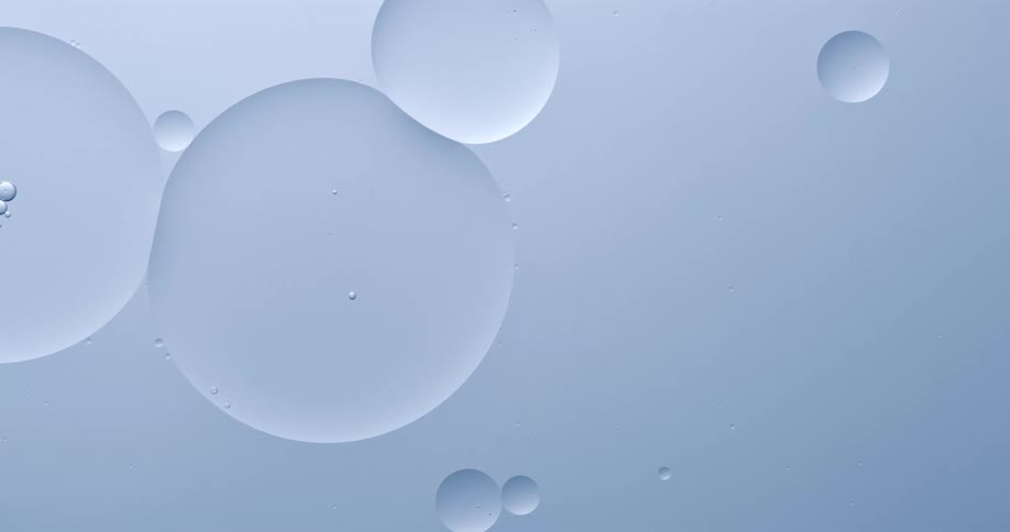 A blue paint flowing with large and small burbles