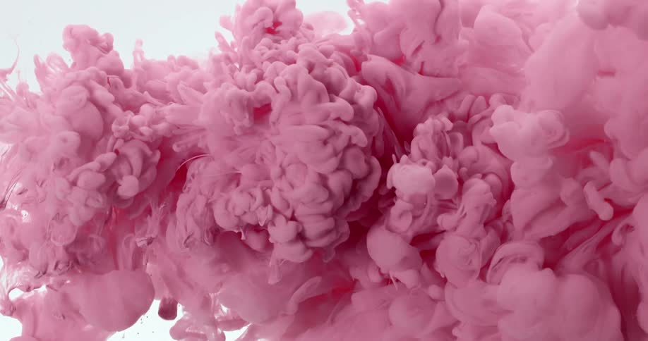 Cloud of bright pink liquid ink flows right