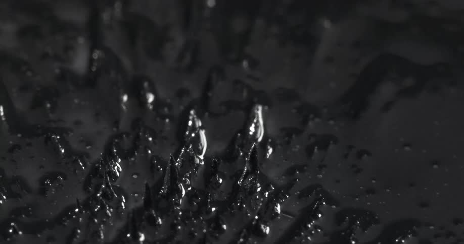 Sharp texture emerging from a liquid in abstract