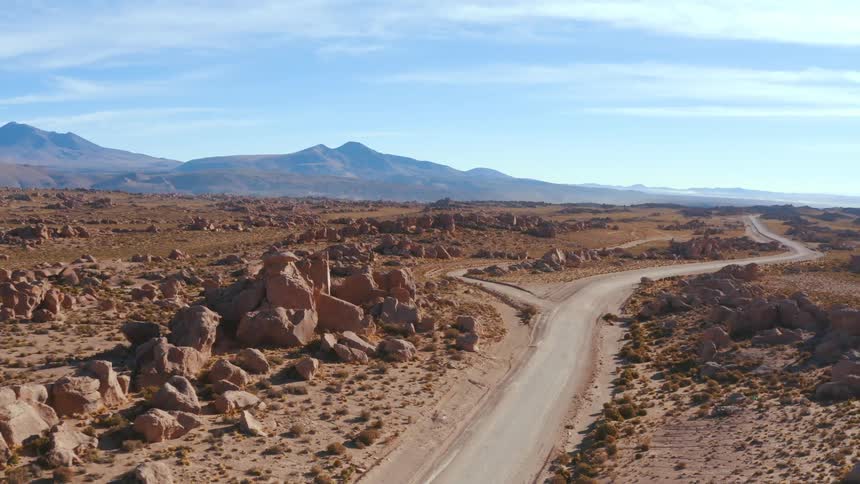 A road in a desert with rocks