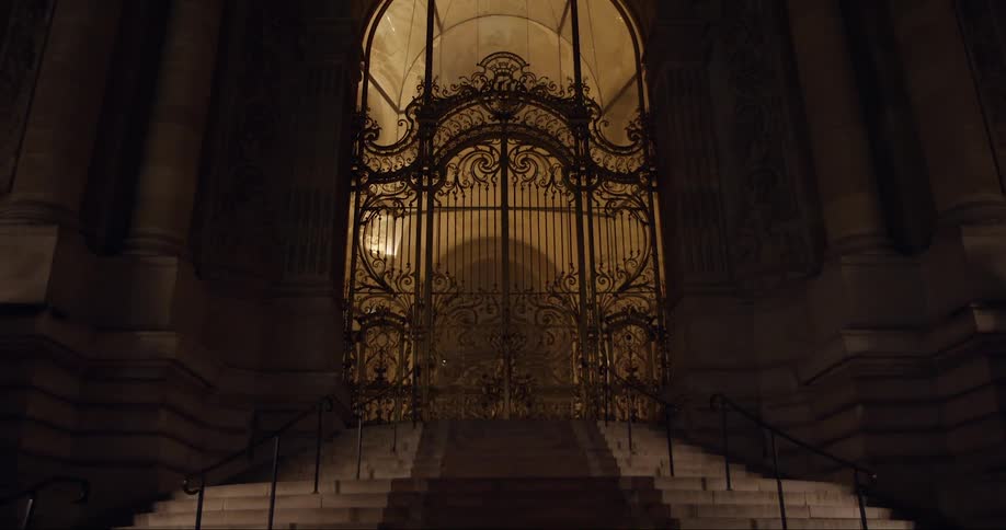 Building with classic architecture with a large iron gate
