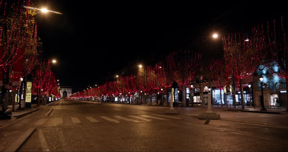 Downtown avenue decorated with flickering colorful lights on a metropolitan area during night time