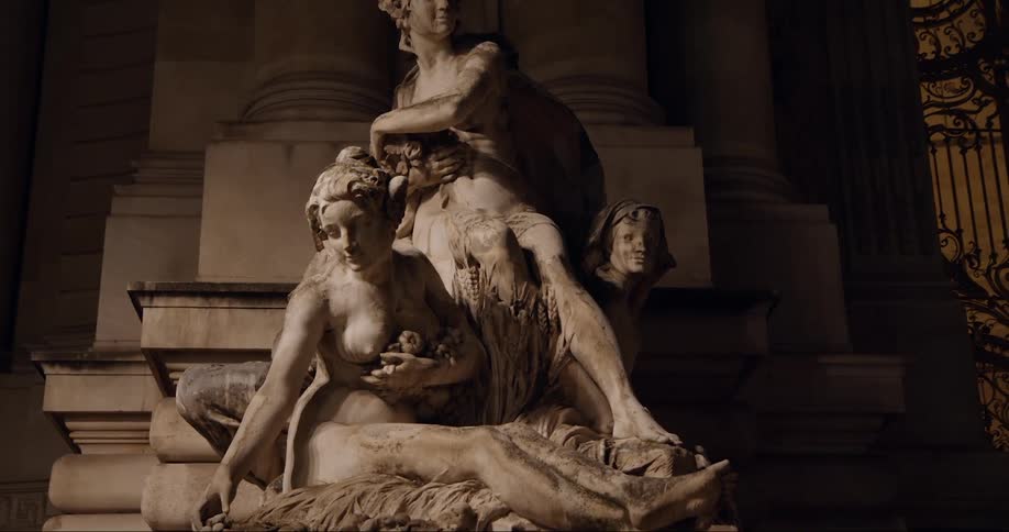 Monument of people in an outdoor statue at night