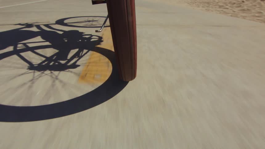 A moving bicycle on a tarred road