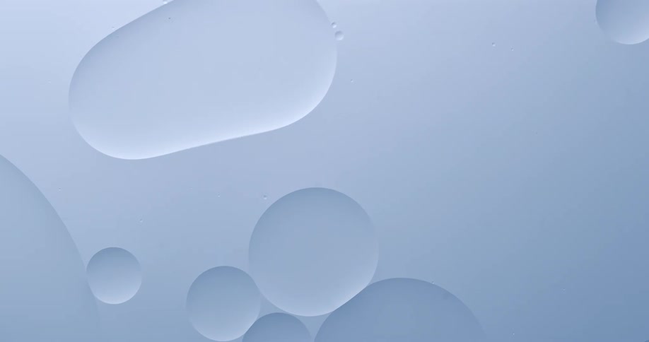Bubbles of various sizes float across bluish liquid