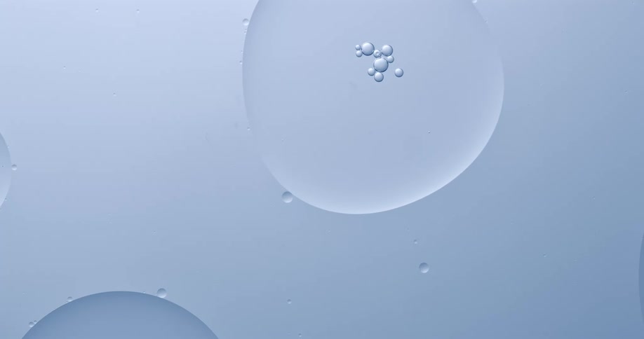 Bubbles on water flowing over a white surface