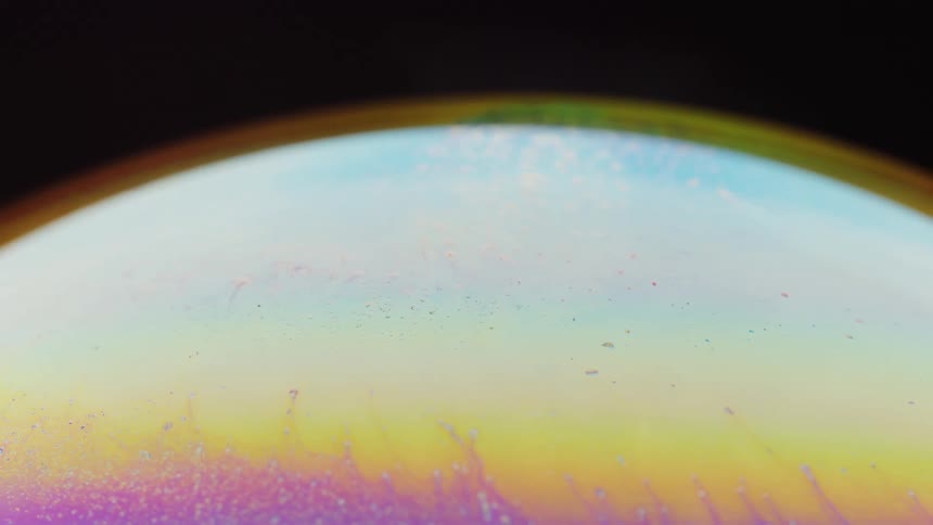 Abstract special effect of a colorful sphere in motion on a black background