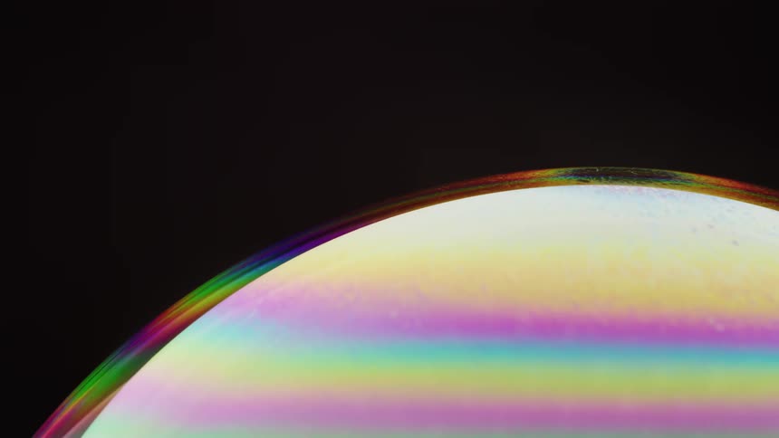 Yellow pink light blue sphere spinning