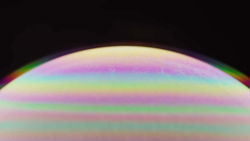 Close up of the bright colorful surface of a soap bubble