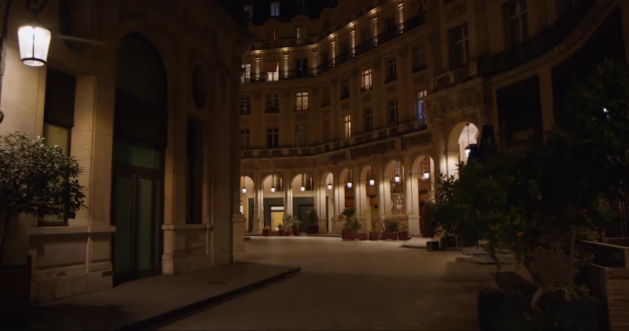 A quiet small street with buildings at night