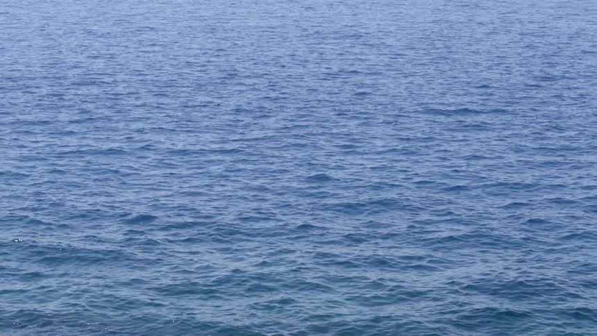 The large body of water has rough waves