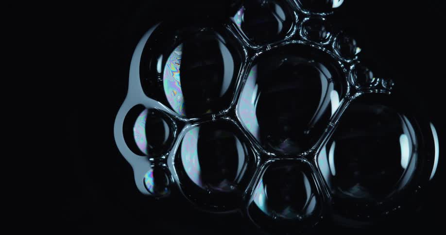 Balls floating in a black liquid