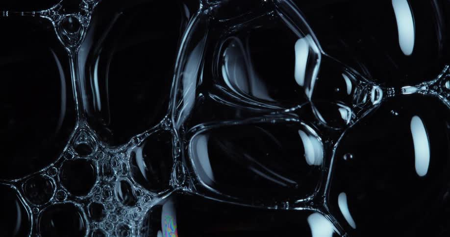 Air bubbles on a black background forming an abstract weblike pattern