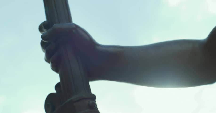 Closeup on the arms of a bronze sculpture
