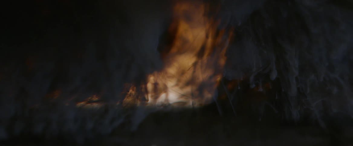 An environment with a lot of gray smoke and behind a strong golden light