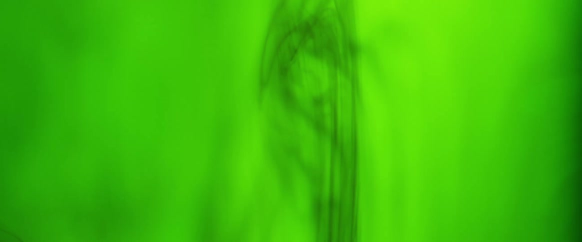 Green smoke with aurora borealis in the sky