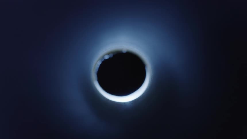 A glowing metallic hole