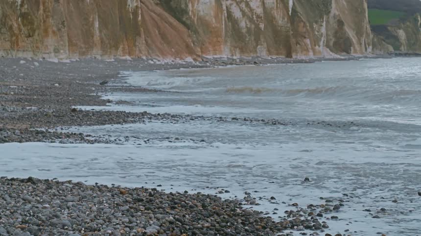 Waves of the sea along the rocks and coastline