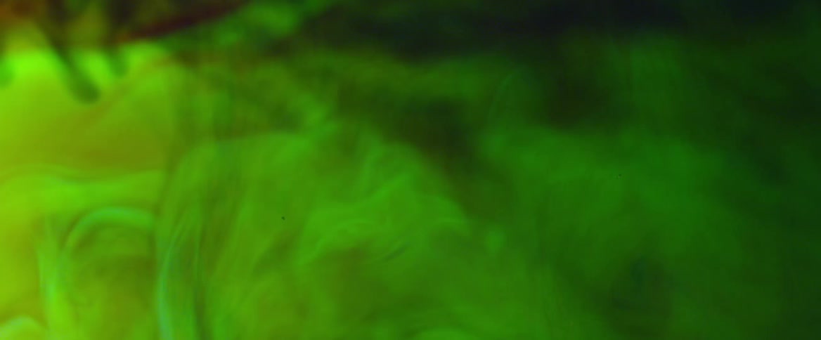 Northern lights in the dark sky covered in green smoke