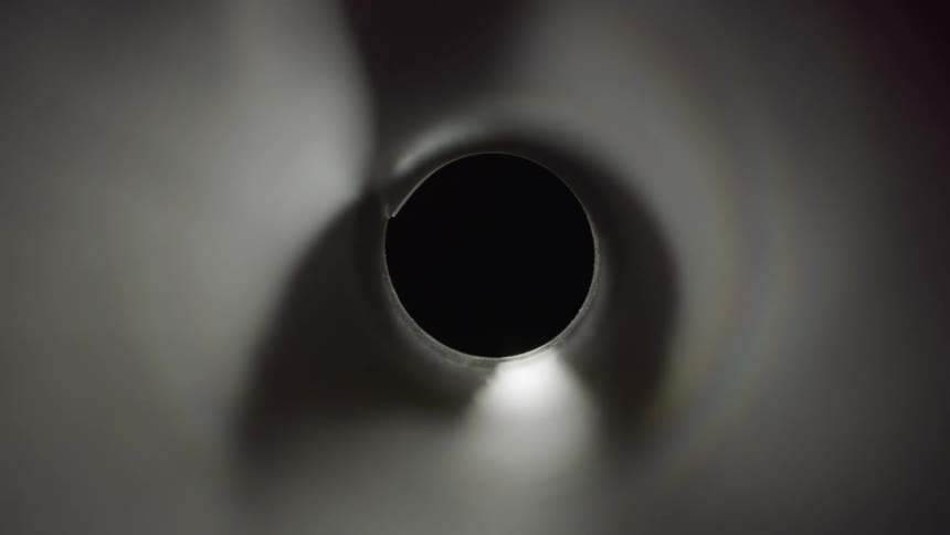 A black hole receiving light on its sides
