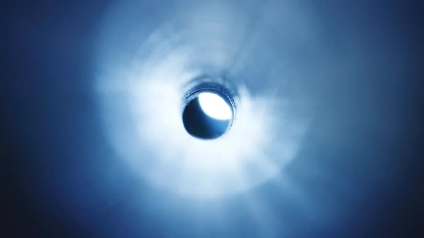 Light passing through the hole at the end of the tunnel
