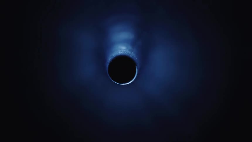 A hole at the end of the tunnel with white lights