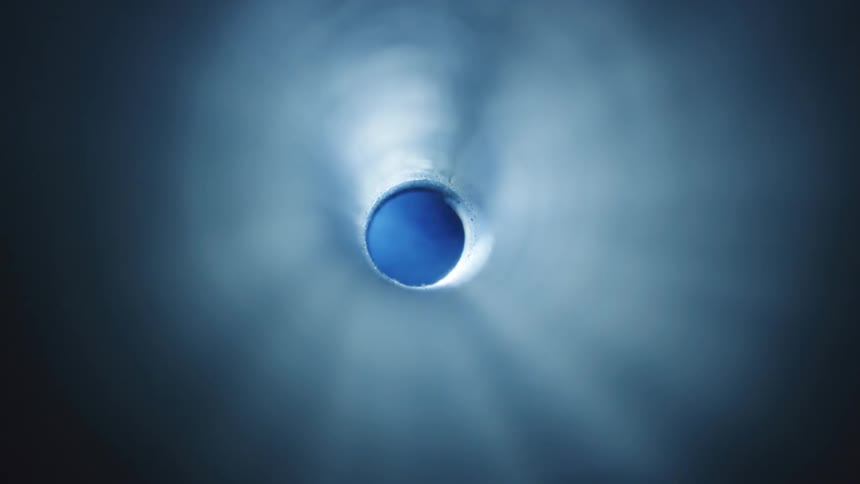 A view of the bright night sky through a tube