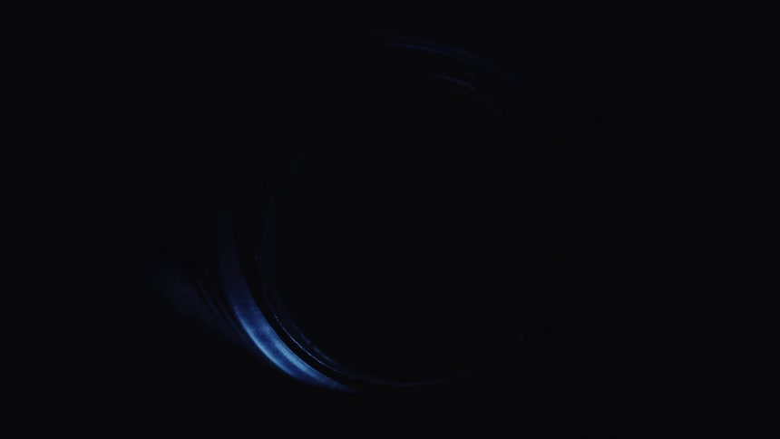 The inside of a cylindrical tube as light moves around it and goes dark