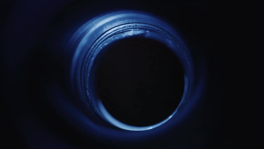 Light passing through a small abstract tunnel