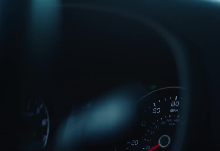 Green turn signal flashes above vehicle speedometer