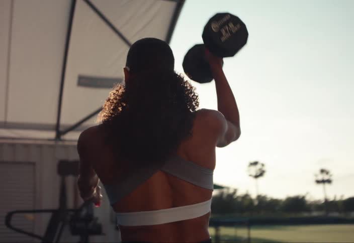 Woman wears hearing aids during an outdoor workout