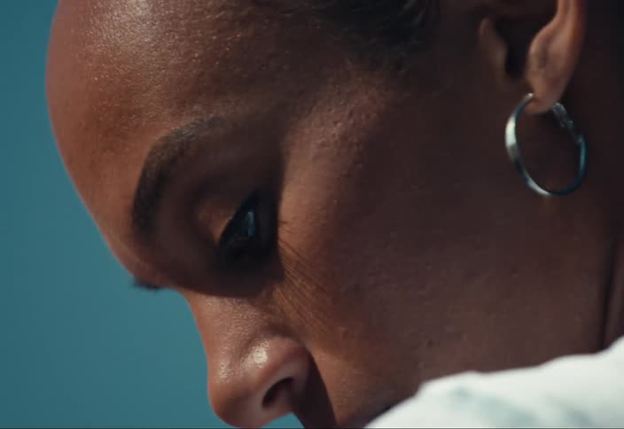 Close up of a woman looking over her shoulder
