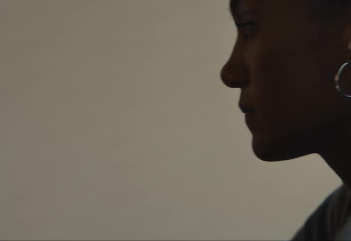 Woman wearing white hearing aid