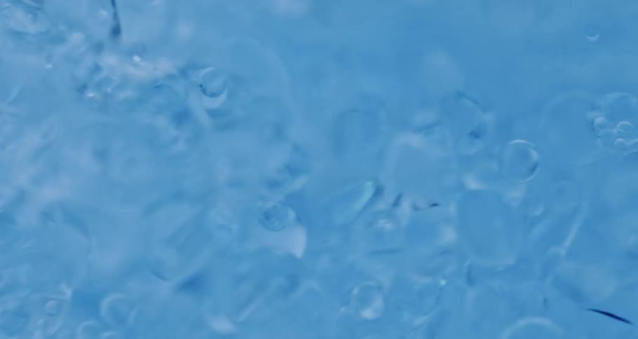 Blue thick liquid bubbling to the right