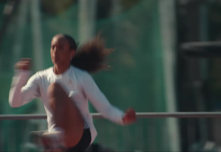 A woman is warming up on the track