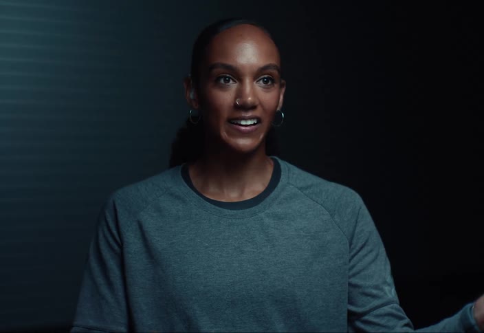 A woman talks to the camera during an interview